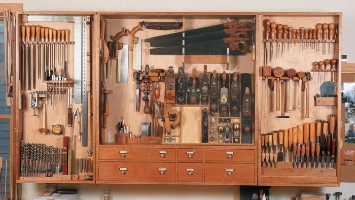 Cabinet maker wall mounted tool chest that folds shut. 